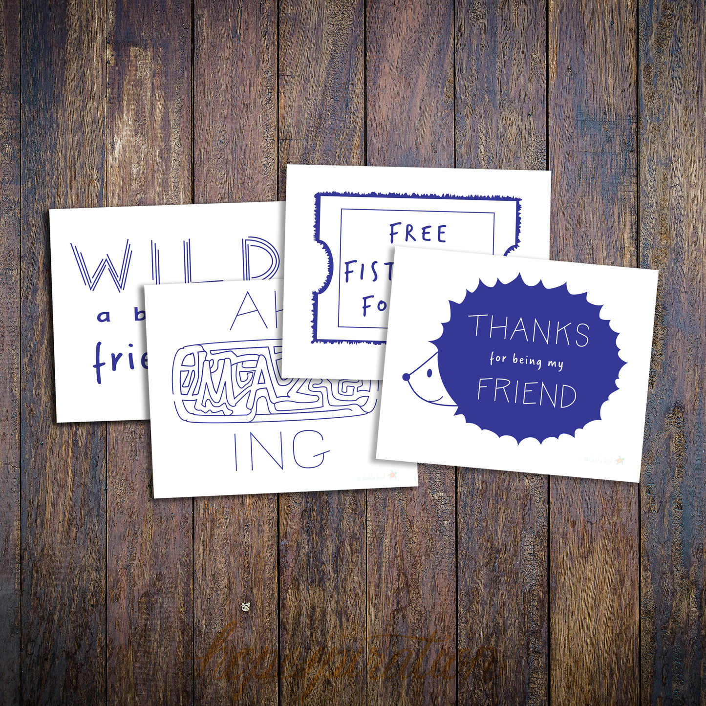 Layout of four friendship cards, in blue and white on wood background.